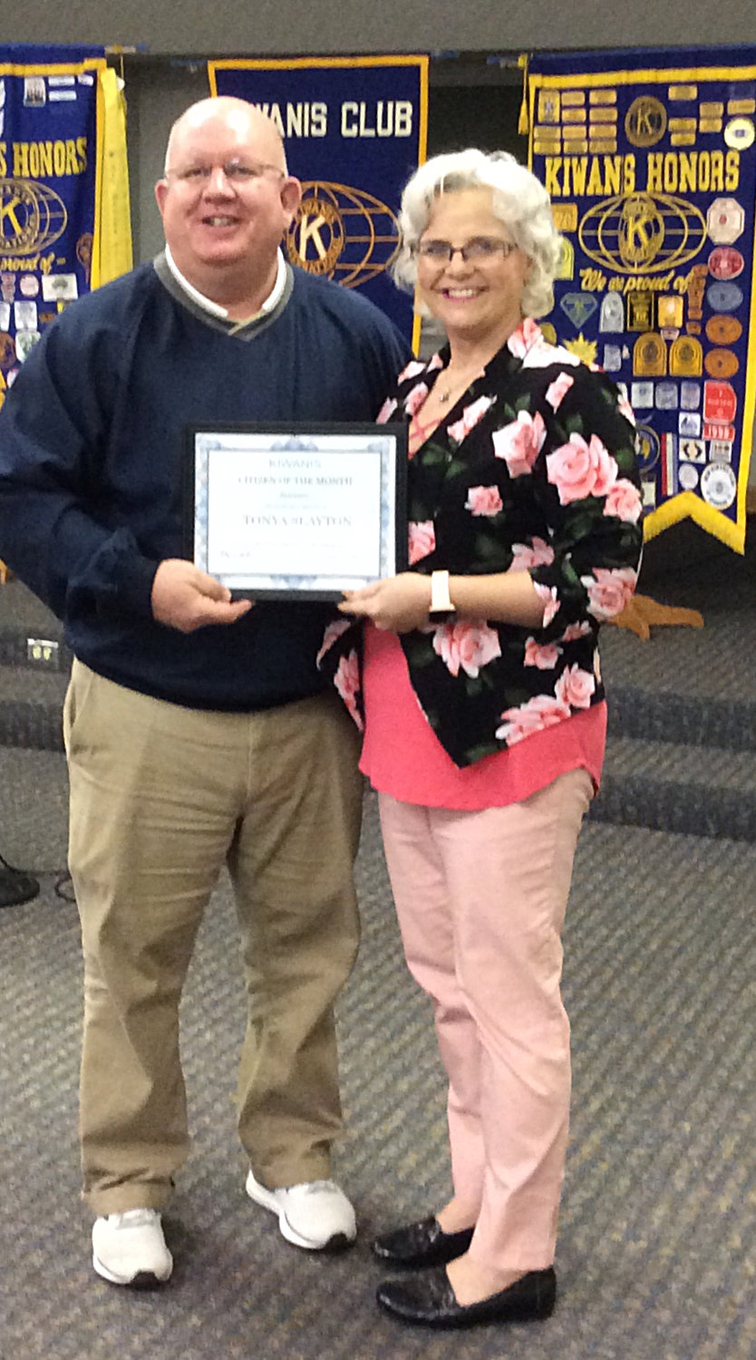 Tonya Slayton is recognized as the January Mineola Kiwanis Citizen of the Month by club president Kevin White.